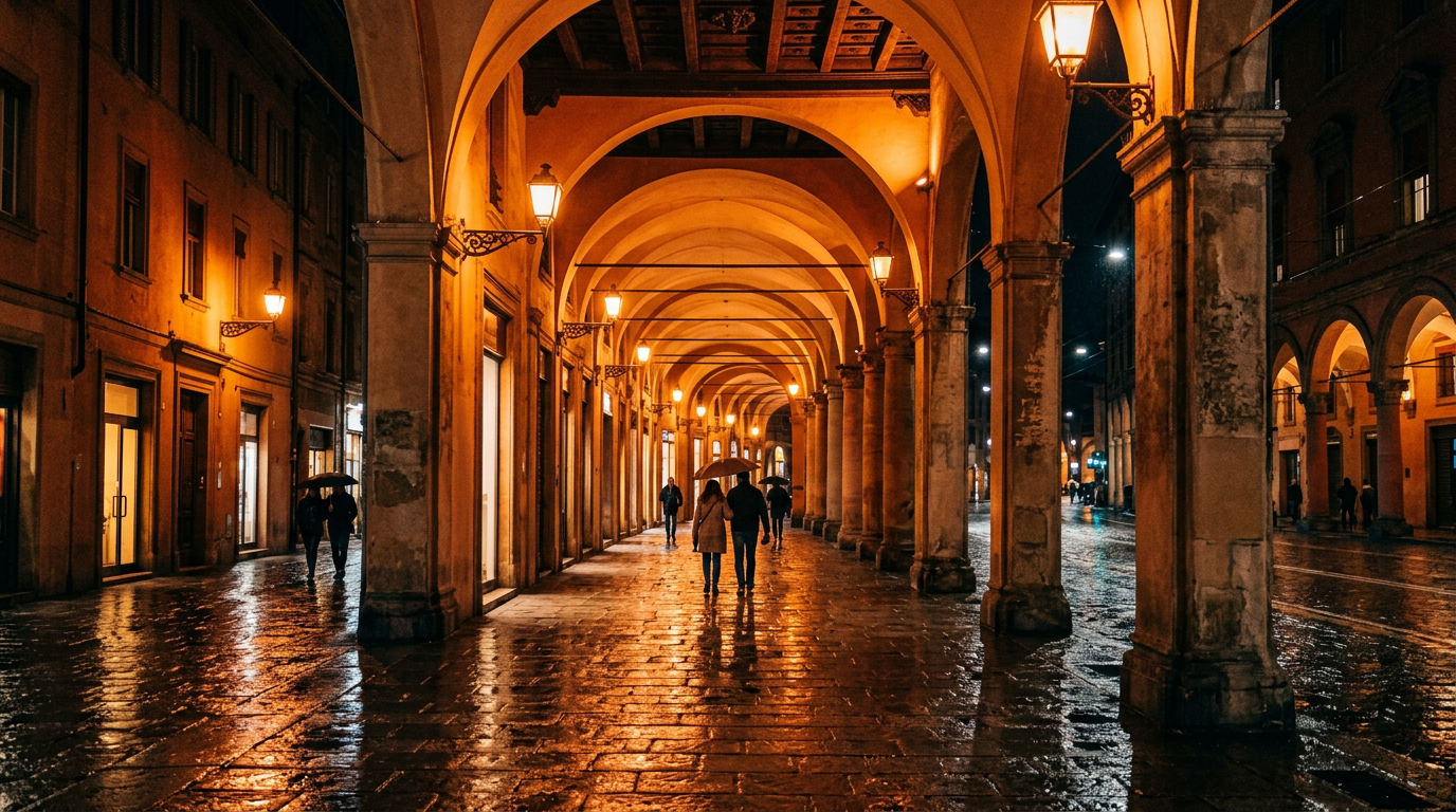 Portici di Bologna con archi medievali e la Torre degli Asinelli visibile in lontananza